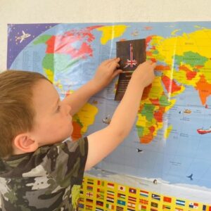 Child learning about countries flags maps at home