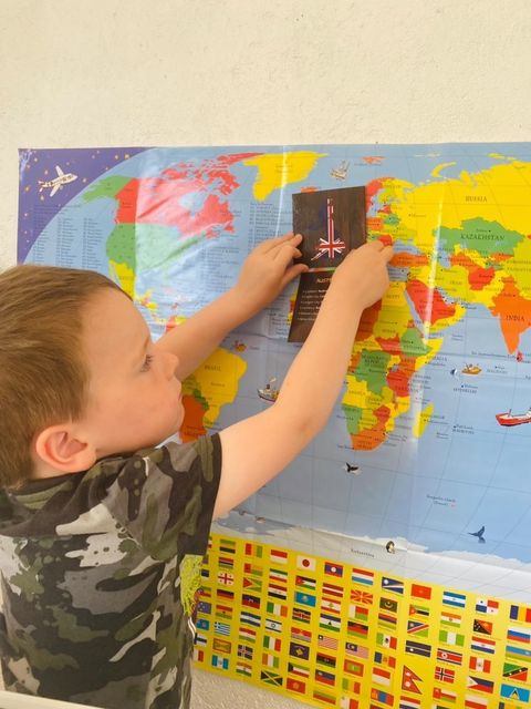 Child learning about countries flags maps at home