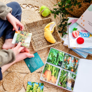 Child learning about where fruits and vegetables grow with Teddo Play Learning Set