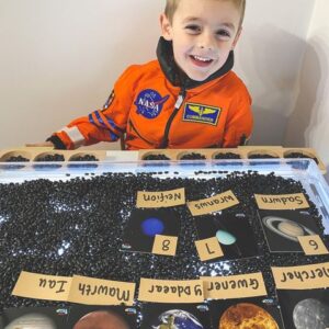 Child learning about planets and solar system through play